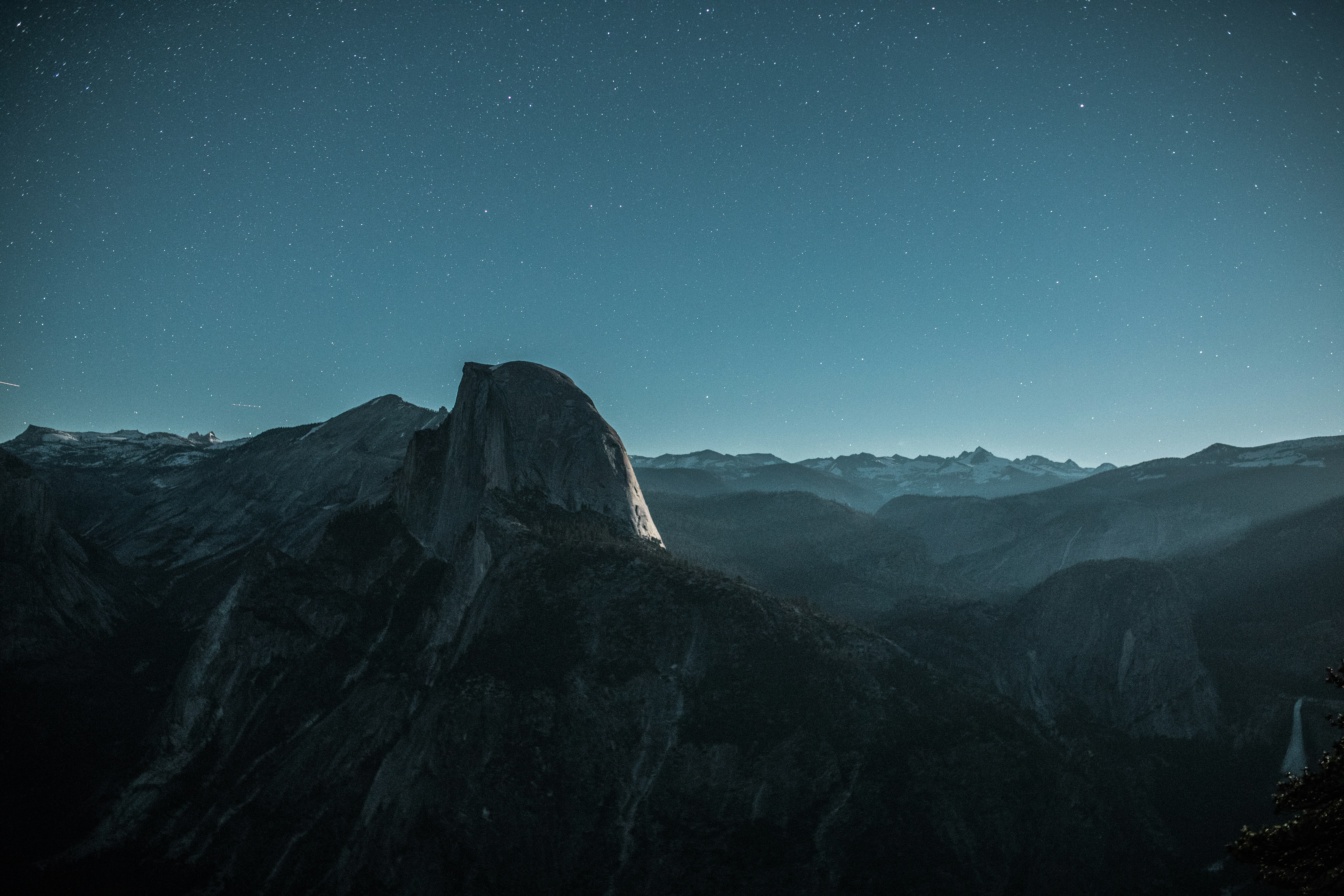 black mountain under blue sky at nighttime